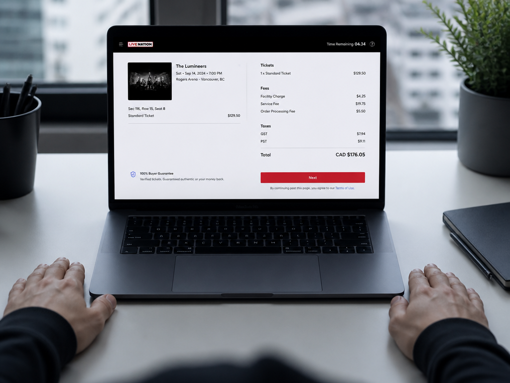 A photorealistic overhead shot of a laptop screen displaying a concert ticket checkout page…